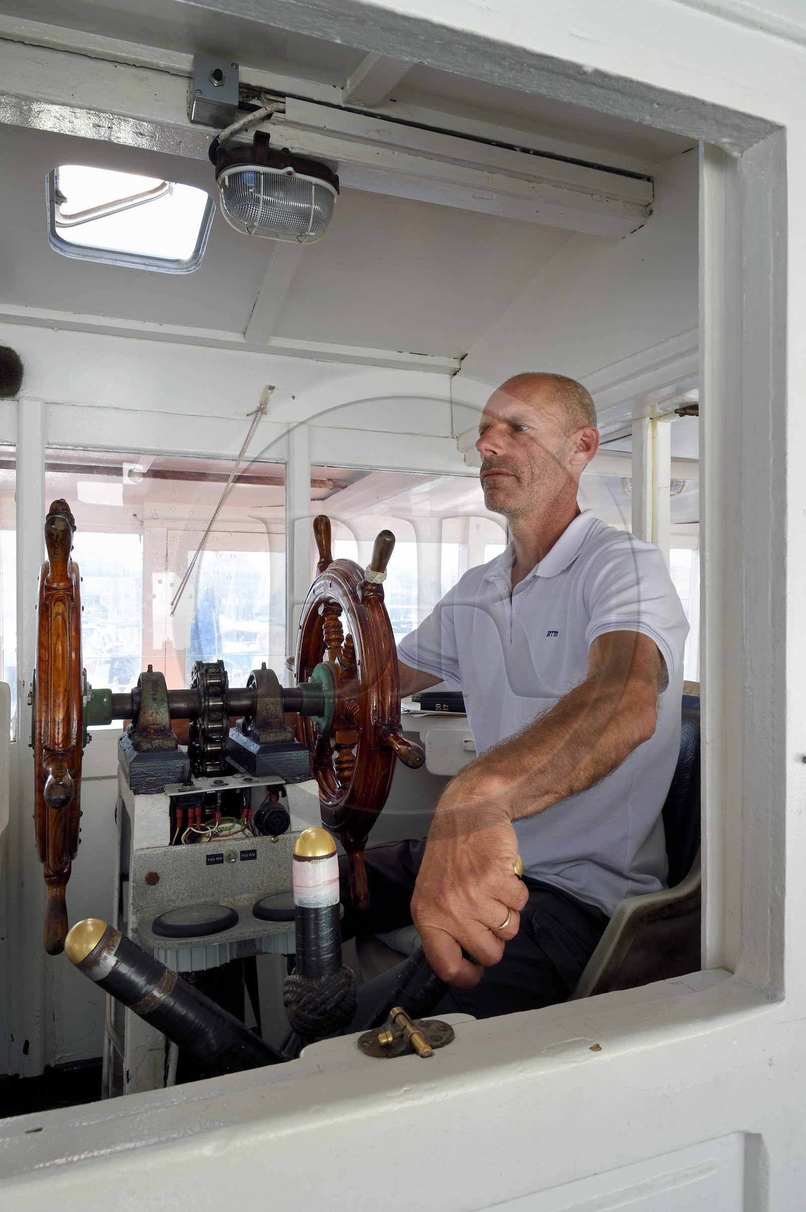 France, Bouches du Rhone, Marseille, the Vieux Port, the pilote Christian Infossi of the Ferry Boat that crosses the port
