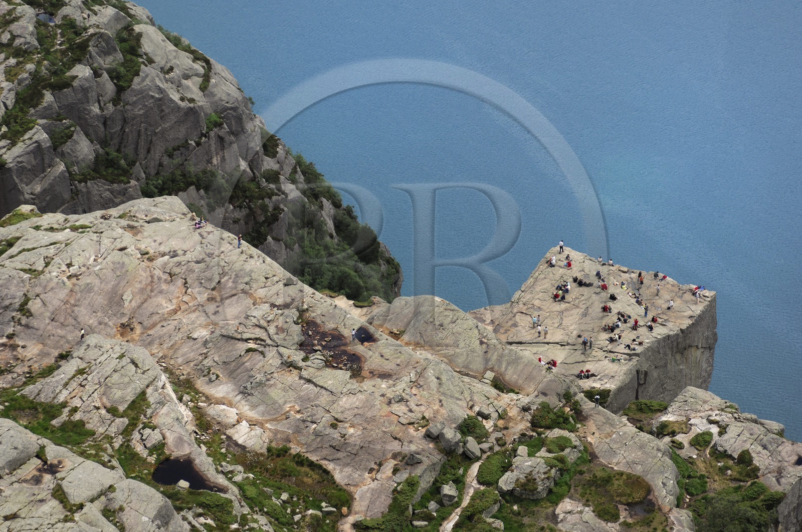 Norway, Rogaland, hikers on the Pulpit Rock (Preikestolen)  in the Lysefjord - fjord of Lysebotn (aerial view)