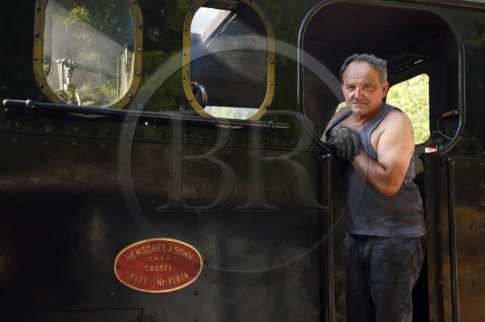 France, Alpes-Maritimes, Puget Theniers, steam engine warming up, Luc Cabouret volunteer of G.E.C.P. that restores and operates the Train des Pignes historic train