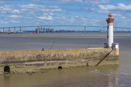France, Loire-Atlantique, Saint-Nazaire, the Vieux Mole lighthouse and the Saint Nazaire bridge in the background (aerial view)