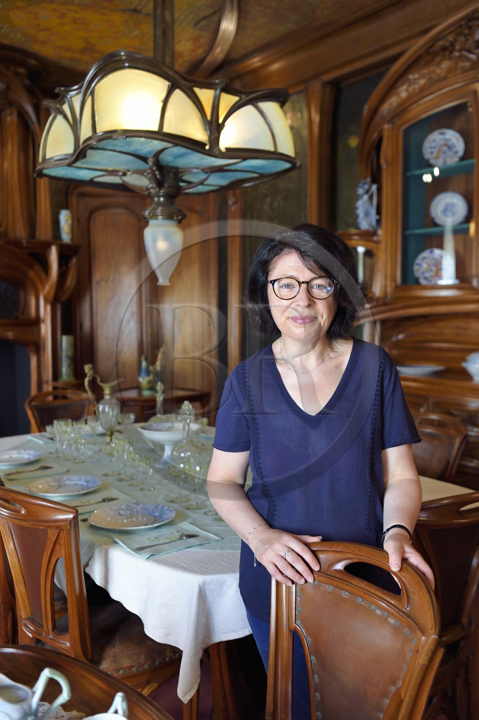 France, Meurthe-et-Moselle, Nancy, Ecole de Nancy Museum, the Art Nouveau dining room of Masson (1903-1906), furniture and woodwork by Eugène Vallin, leather panels and ceiling by Victor Prouvé, the curator Valerie Thomas