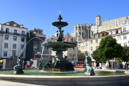 Portugal, Lisbon, Baixa Pombal district, Don Pedro IV (Rossio) square, Baroque Fountain and Do Carmo Church in the background