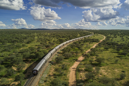 Namibia, Otjozondjupa region, the Shongololo express train crossing the Namibian bush towards Kalkfeld (aerial view)