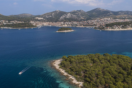 Croatia, Dalmatia, Dalmatian coast, Island of Hvar, the town of Hvar protected by the Infernal Islands (in Croatian Paklinski otoci) in the foreground (aerial view)