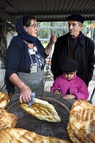 Azerbaijan, Shaki region, Kish, baking the traditional oven bread tendir (tandir) by Garazada family refugee of Nagorno Karabakh since 1994