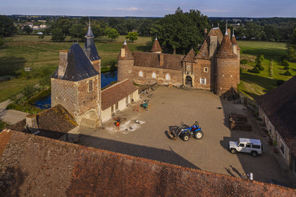 France, Allier (03), former province of Bourbonnais, Chapeau, Chateau de la Cour (15th century to late 16th century), with a decor of black brick herringbone on a background of red bricks (aerial view)