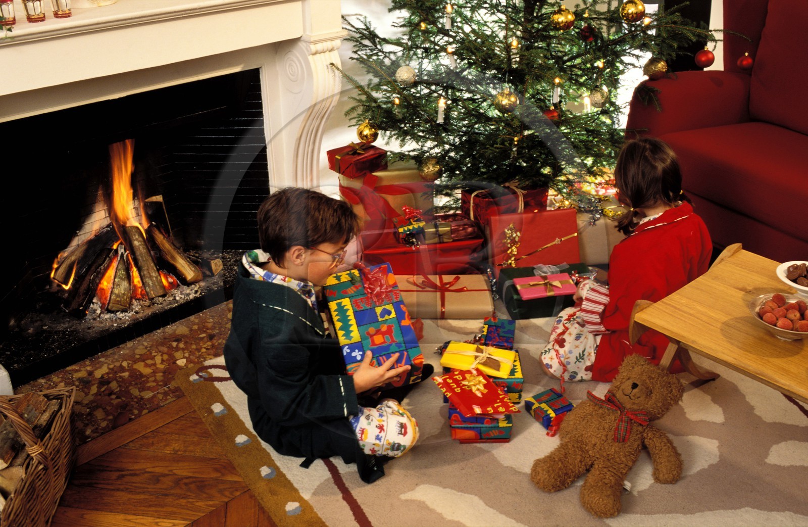 France, Christmas, children in front of the chimney with their presents
