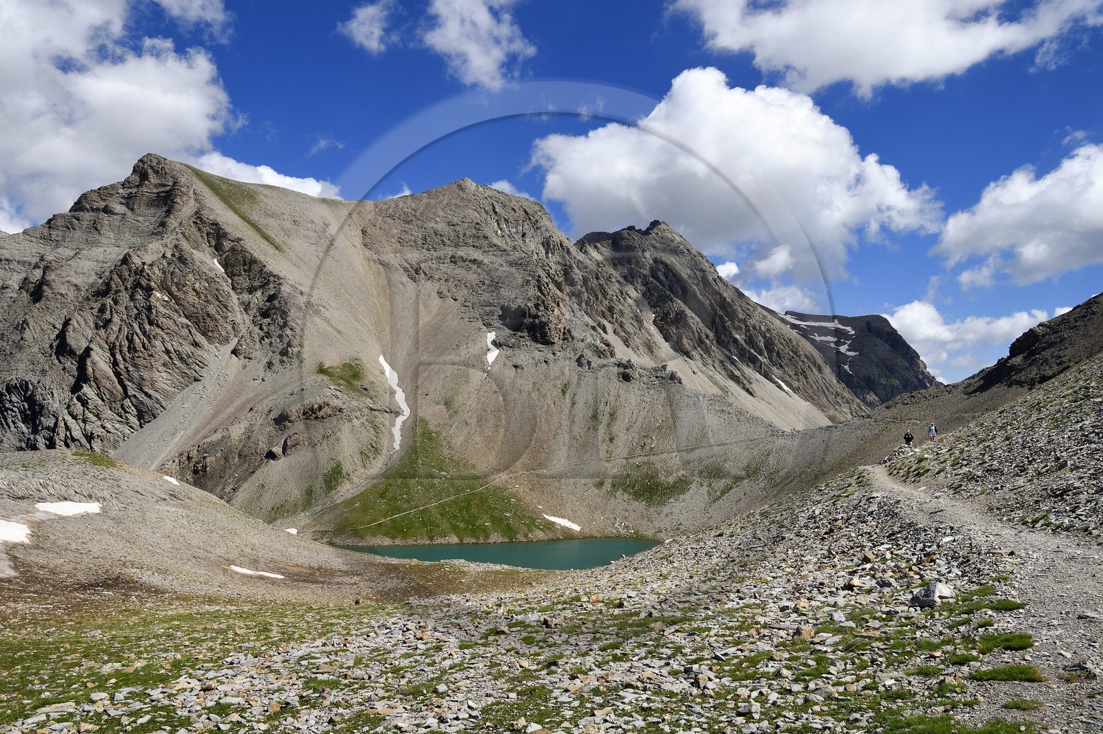 France, Alpes de Haute Provence, Uvernet Fours, Mercantour National Park, Ubaye valley, lake tour hiking trail at the Petite Cayolle pass (2639 m) under the mountain top of the Eagle Hole and mount Pelat