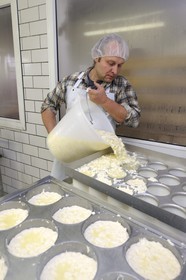 France, Haut Rhin, scenic road of la route des Cretes, Rural Inn Marcaire du Grand Hetre, Jean-Mathieu Spenle preparing the munster cheese