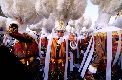 Belgium, Wallonia, Binche, Carnival of Binche, Gilles of Binche in the procession wearing their hat and throwing oranges