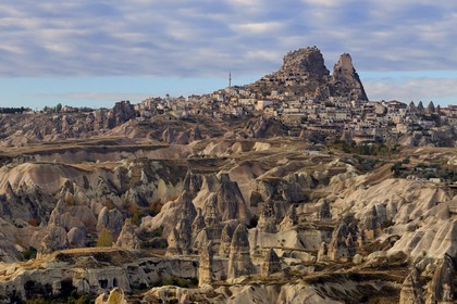 Turkey, Central Anatolia, Nevsehir Province, Cappadocia listed as World Heritage by UNESCO, the village of Uchisar and fairy chimneys (aerial view)