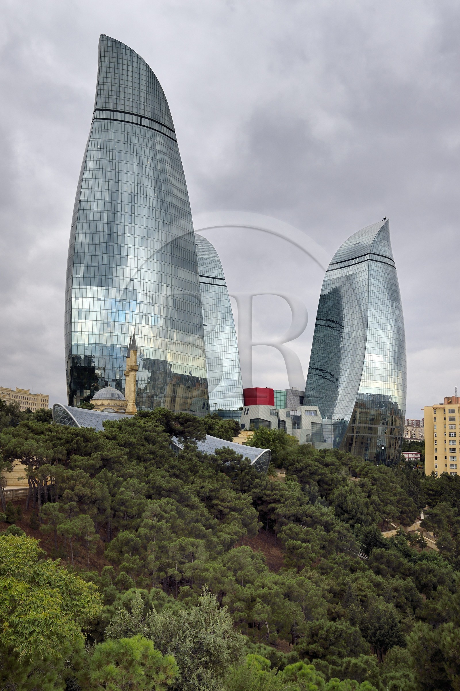Azerbaijan, Baku, Flame Towers by architects Hellmuth, Obata & Kassabaum and the Shehidler Mosque at his feet