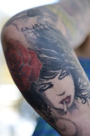 Greece, Cyclades islands, Mykonos island, Chora (Mykonos town), tattoos on a woman's arm