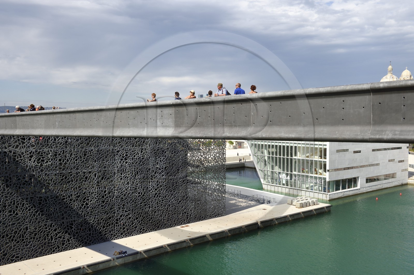 France, Bouches du Rhone, Marseille, bridge to the MuCEM (Museum of Civilizations of Europe and the Mediterranean) by architects Rudy Ricciotti and R. Carta and La Villa Méditerranée by architect Stefano Boeri in background