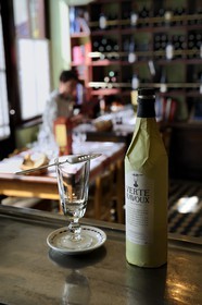 France, Val d'Oise, Auvers sur Oise, Ravoux inn where Van Gogh lived just before his death, the dining room on the ground floor, absinthe set including the bottle, a slotted spoon for sugar and a glass