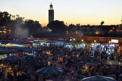 Morocco, High Atlas, Marrakech, Imperial city, Medina listed as World Heritage by UNESCO, Jemaa el-Fna square and the minaret of the Koutoubia mosque in the background