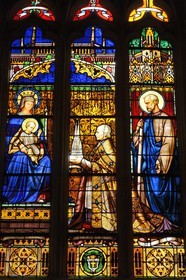France, Finistere, Quimper, St Corentin Cathedral, Stained Glass (1857) representing Bishop Graveran holding the model of the cathedral spiers in the presence of Our Lady and St Corentin