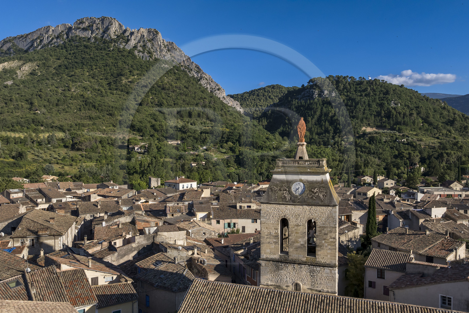 France, Drome, regional natural park of Baronnies provencales, Buis les Baronnies overlooked by the large limestone blade of the Rocher de Saint-Julien, the church of Our Lady of Nazareth (13th century) in the foreground (aerial view)