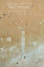 France, Alpes-Maritimes, parc national du Mercantour (Mercantour National Park), the Vallee des Merveilles (Valley of Wonders) towards the Pas de l'Arpette (Arpette pass), rock engraved with hornlike figures, daggers, linear incisions and a graffiti from Battista Maro who is probably the shepherd who has the most left his mark on the site at the beginning of last century