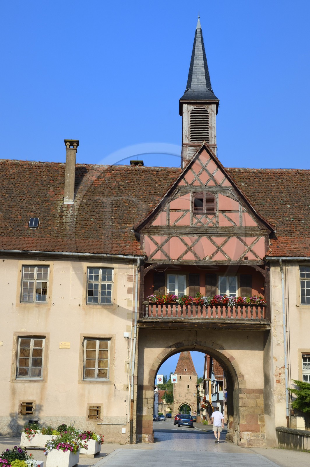 France, Bas Rhin, Rosheim village, General de Gaulle street, School gate and Virgin gate in the background