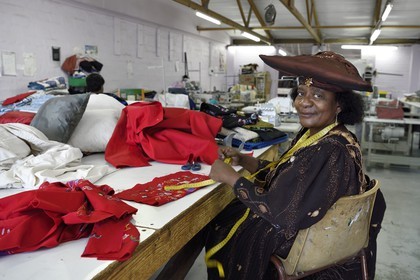 Namibia, Khomas region, Windhoek, Katutura township, Naomie seamstress in the Penduka Village craft center in Herero traditional dress