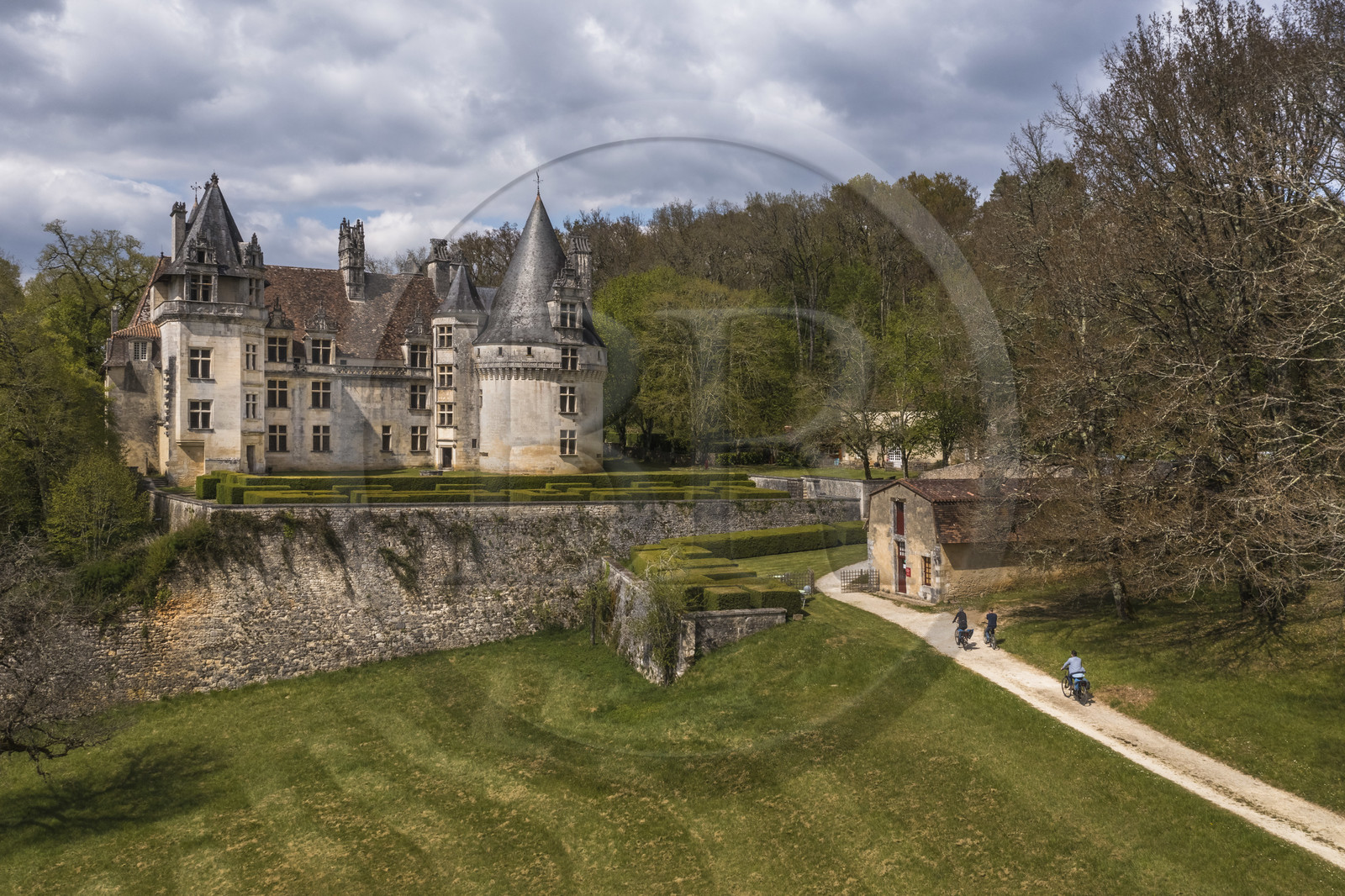France, Dordogne, Périgord Vert, Villars, cyclists traveling along the Flow Vélo cycle route in front of Renaissance style Puyguilhem castle (aerial view)