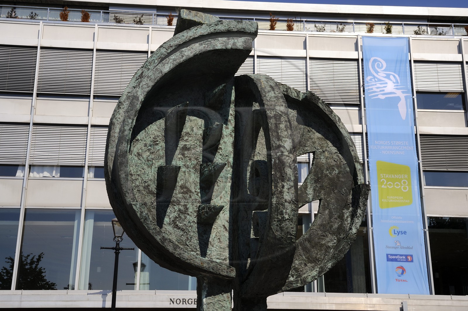 Norway, Rogaland County, Stavanger, sculpture in front of the tourist information center and 2008 Stavanger poster
