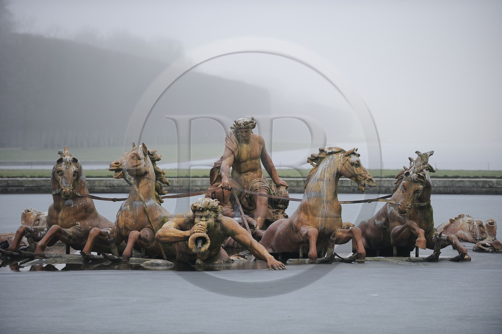France, Yvelines, Chateau de Versailles, listed as World Heritage by UNESCO, Apollo basin in the winter fog