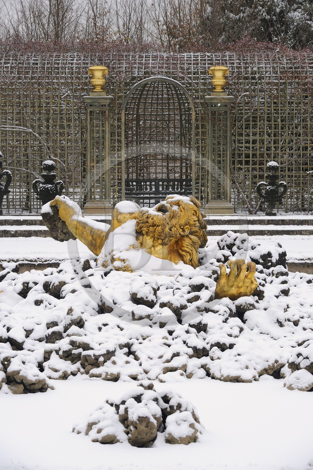 France, Yvelines, snow covered park of the Chateau de Versailles, listed as World Heritage by UNESCO, Bosquet de l'Encelade (Encelade Grove) by Marsy