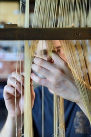 France, Rhone, Lyon, La Croix Rousse District, Silk manufacturer Prelle, silk loom developed by Joseph Marie Jacquard called Jacquard loom, the canut (lyonnais silk worker) Sebastien preparing his loom