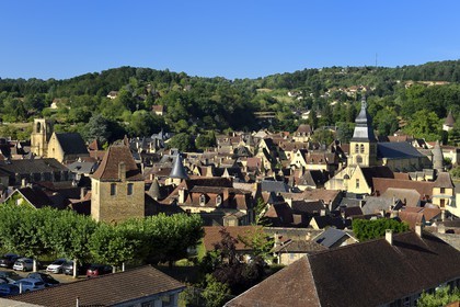 France, Dordogne, Perigord Noir, Dordogne valley, Sarlat la Caneda,  old town with the cathedral of Saint Sacerdos dated 16th century in the background right and St. Mary's Church converted into a covered market and cultural center by the architect Jean Nouvel left