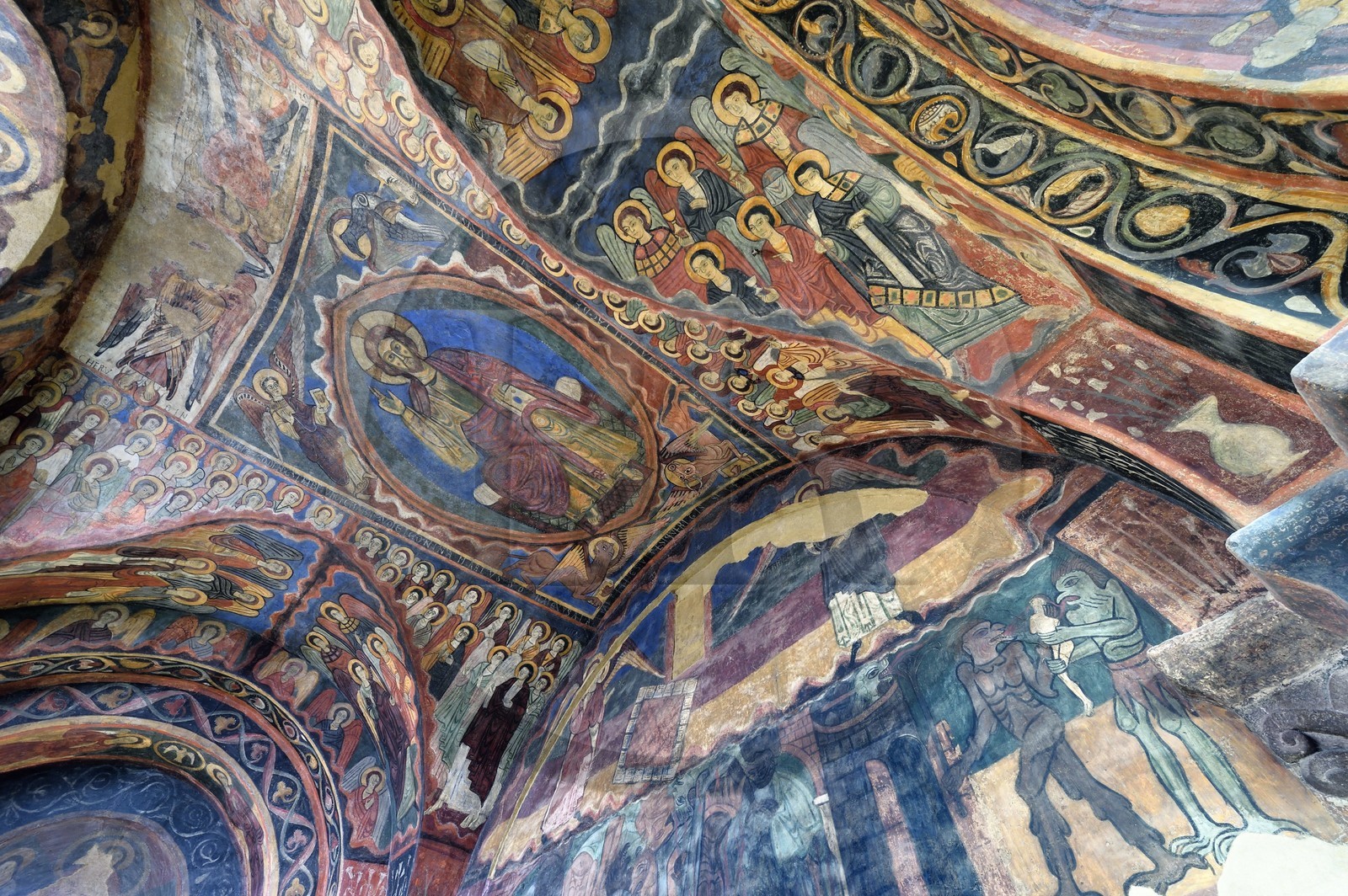 France, Haute Loire, Brioude, the Basilica of Saint-Julien de Brioude in Auvergne Romanesque style, 13th century frescoes in the Saint Michel chapel, Christ in glory is surrounded by the four evangelists, angels and saints, down representation of hell with demons taking souls
