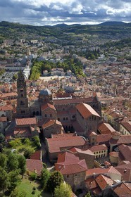 France, Haute Loire, Le Puy en Velay, Routes of Santiago de Compostela, the 12th century Our Lady (Notre-Dame-de-l'Annunciation) cathedral listed as World heritage by UNESCO, the prefecture of Haute-Loire in the background