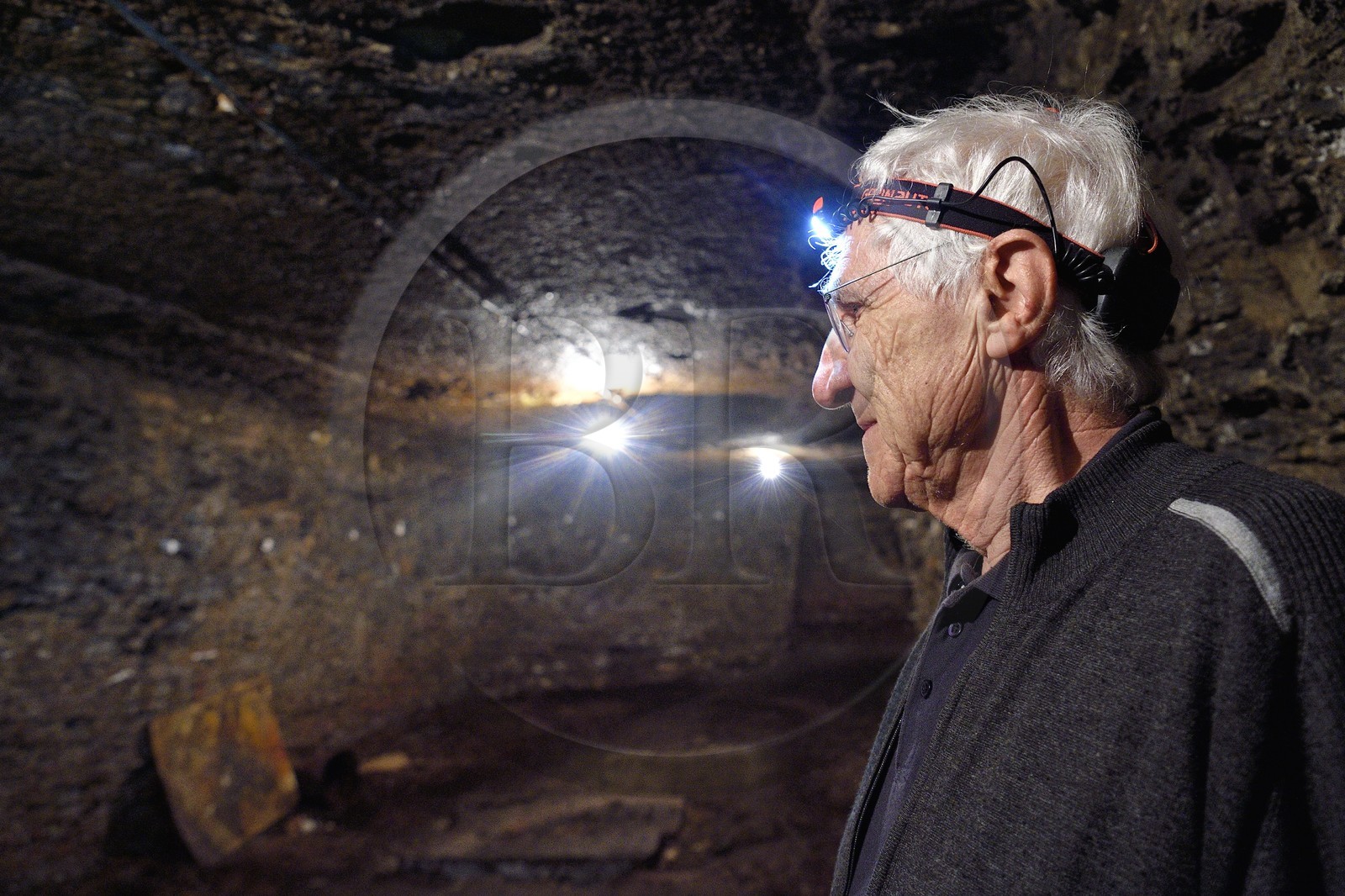 France, Puy de Dome, Clermont Ferrand, rue Pascal, Hotel Martial de Grandseigne, René Ribeyre member of the ACAVIC association (Amis des Caves du Vieux Clermont) in the tuff cellars on three levels