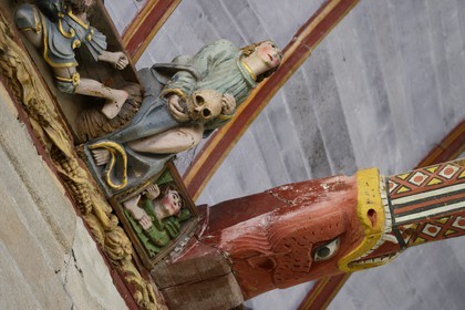 France, Finistere, Pleyben church, wooden painted sculptures on the stringer decorating the vault