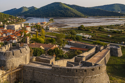 Croatia, Dalmatia, peninsula of Peljesac, the old town of Ston and the ancient salt marshes in the background (aerial view)