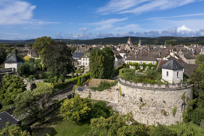 France, Cote d'Or, Climats terroirs of Burgundy listed as World Heritage by UNESCO, Beaune, one of the two remaining towers of the Château de Beaune (early 16th century) on the ramparts to the east, the vineyards of the Côte de Beaune in the background (aerial view)