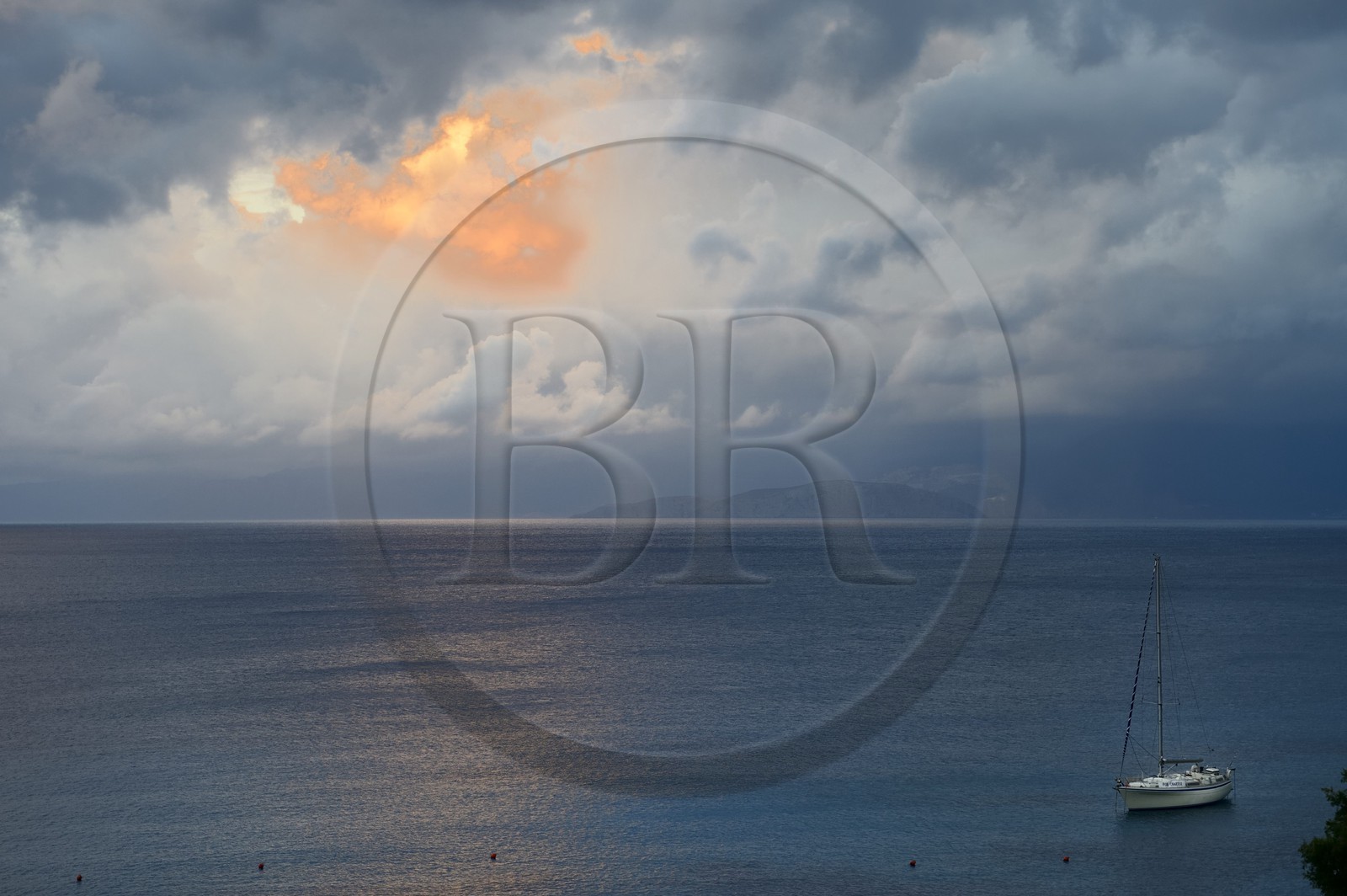 Greece, Crete, Agios Nikolaos region, Elounda, stormy sky at sunset