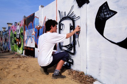 France, Saone et Loire, Chalon sur Saone, graffiti on walls, taggers drawing on a neglected wall