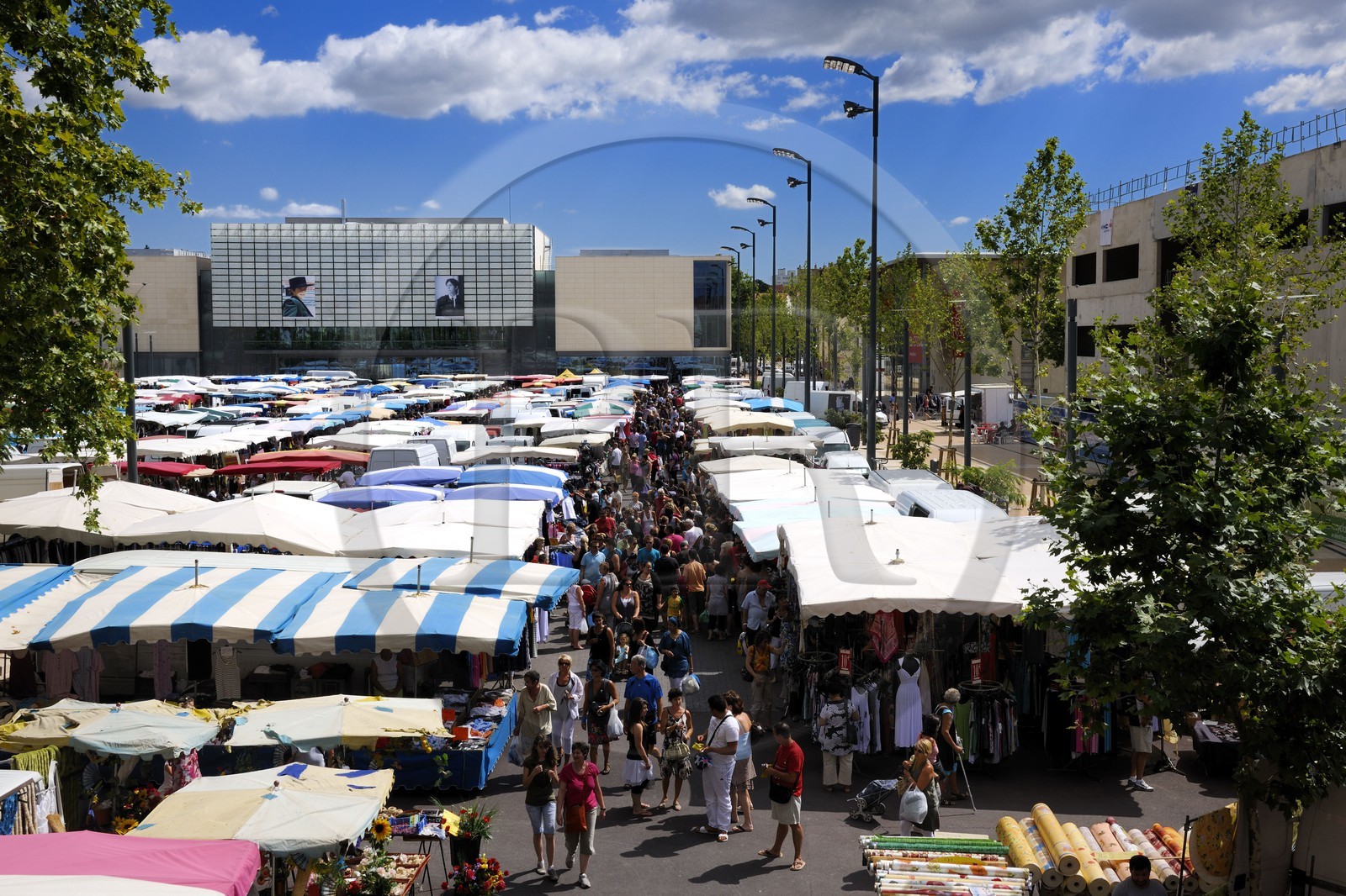 France, Herault, Beziers, the district of the Champ de Mars, the friday market on the 14th of july place and the multimedia library Andre Malraux