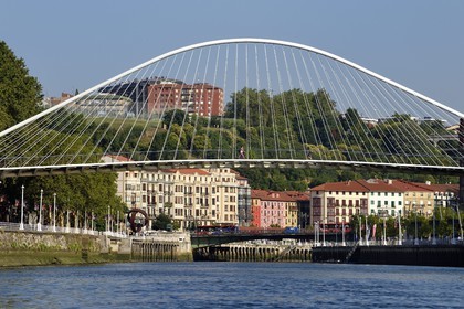 Spain, Basque Country, Biscay Province, Bilbao, Zubizuri suspended footbridge designed by the architect Santiago Calatrava over the Ria de Bilbao