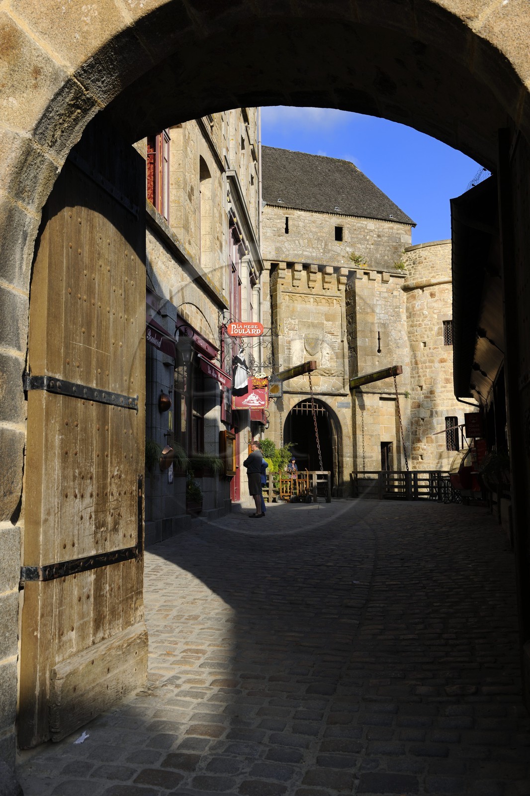 France, Manche, Mont Saint Michel, listed as World Heritage by UNESCO, the King Gate and the restaurant La Mère Poulard