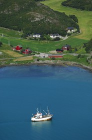Norway, Sor-Trondelag, Orlandet island, fishing boat, farm and agriculture (aerial view)