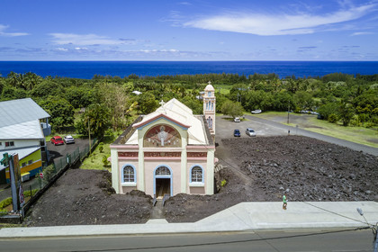 France, Ile de la Reunion, l'église Notre-Dame-des-Laves de Piton Sainte-Rose épargnée par la coulée de lave de 1977 (vue aérienne)