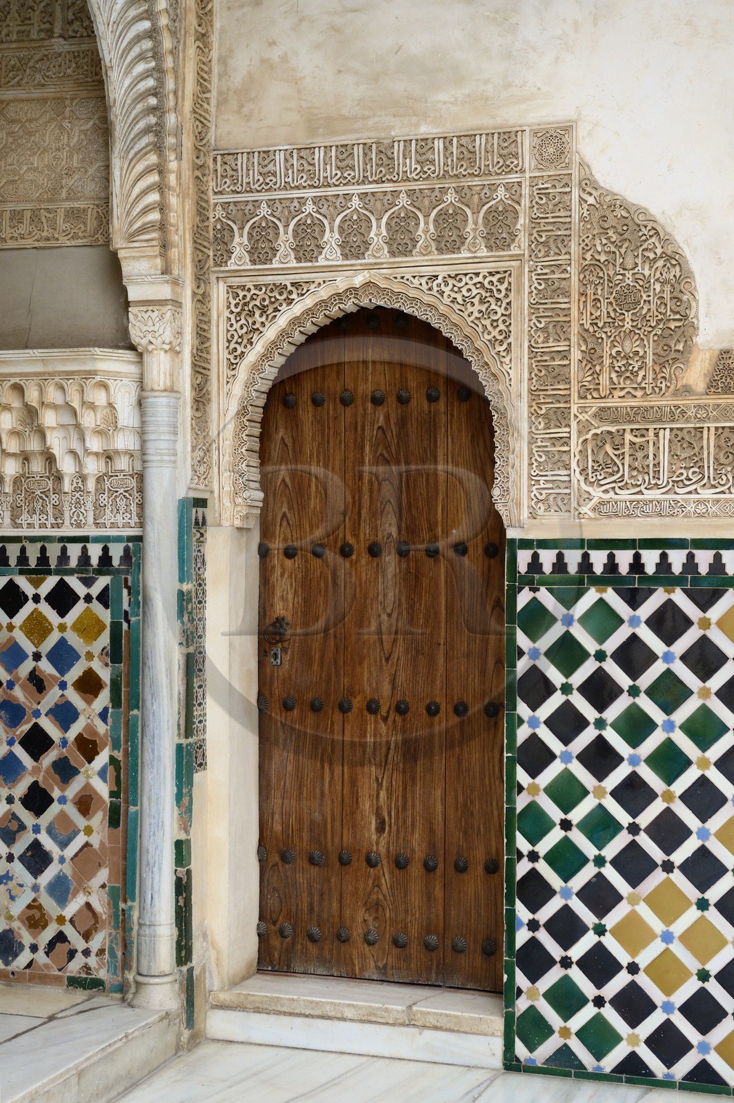 Spain, Andalusia, Granada, Alhambra Nasrid Palace, listed as World Heritage by UNESCO, Comares Palace, inscription from a poem by Ibn Zamrak in honour of Mohammed V after Algeciras was conquered in 1368 on the top of the skirting board in the northern gallery of the Court of the Myrtles (Patio de los Arrayanes)