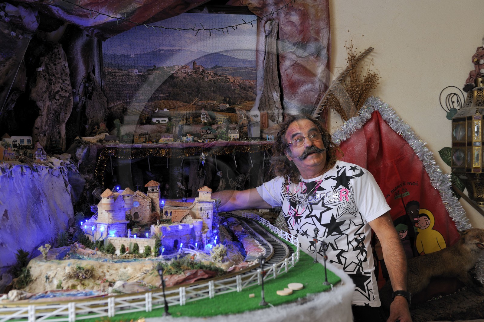 France, Herault, Beziers, Mr. Azzopardi beside his models in his home street rue du chapeau rouge