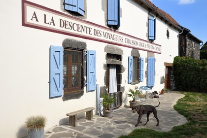 France, Cantal, Parc Naturel Régional des Volcans d'Auvergne (regional nature park of Auvergne volcanoes), step on the Way of St. James to Santiago de Compostela by Via Arverna, Chalinargues, 1806 sign of a former post relay restored identically