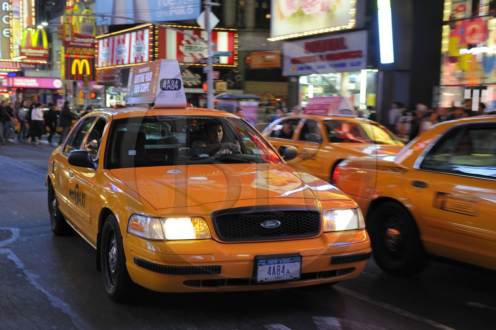 United States, New York, Manhattan, Theater district on Broadway Avenue, yellow cab in Times Square