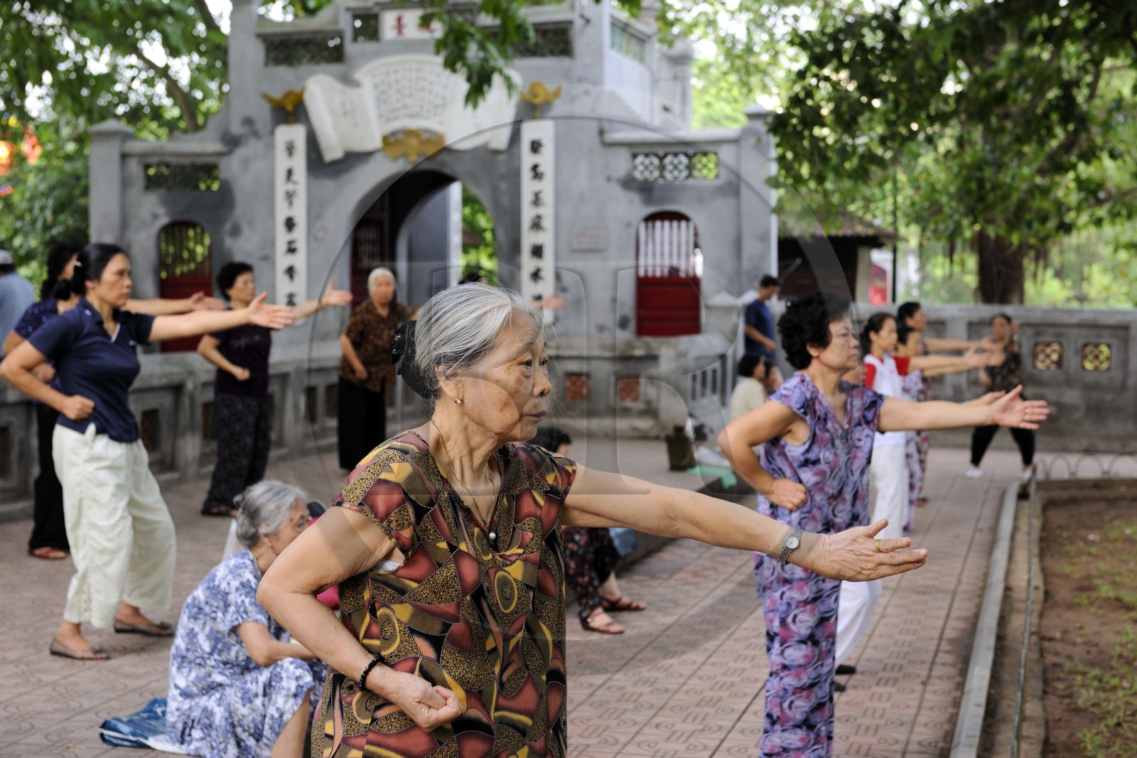 Vietnam, Hanoi, old town, Hoan Kiem Lake also called the small lake or Lake of the Restored Sword, people doing Tai chi