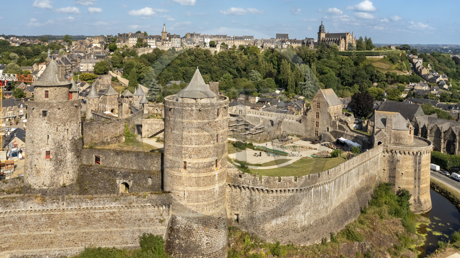 France, Ille-et-Vilaine, Fougeres, 12th century fortified castle and the Saint-Léonard church in the background (aerial view)